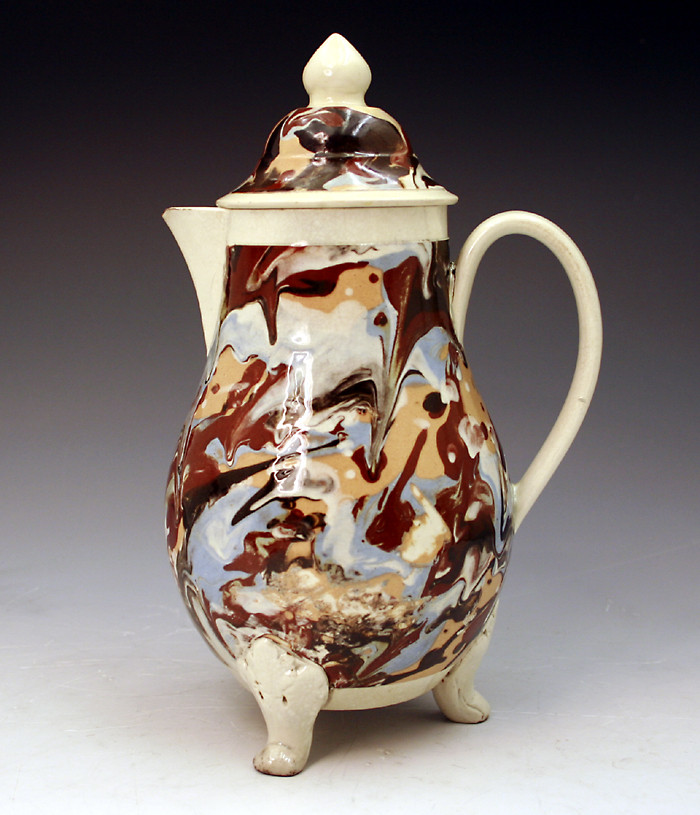 Early English pottery variagated surface decorated mocha jug with cover