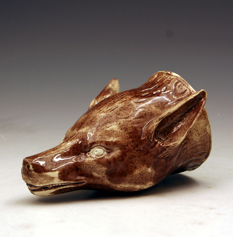 Staffordshire pottery stirrup cup in the form a fox late 18th century