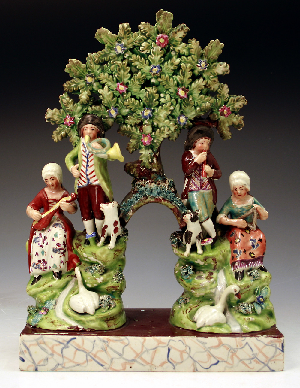 Staffordshire pottery double arbour group known as the SONGSTERS