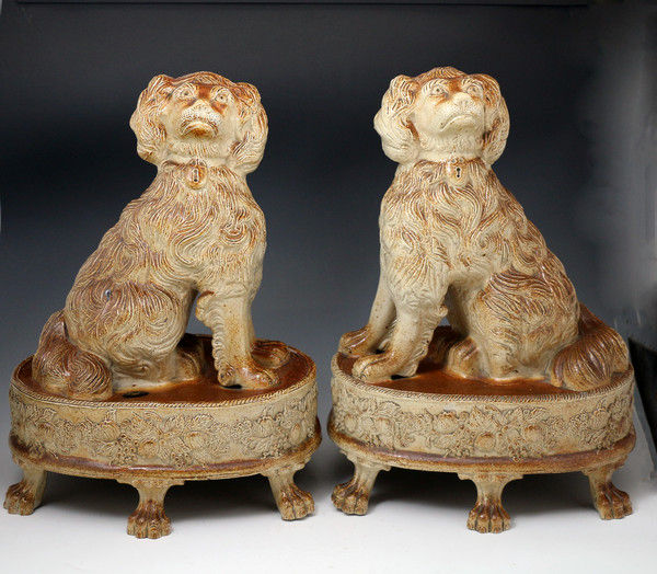 Pair of English saltglaze pottery figures of Spaniels on bases Briddon Derbyshire c1835