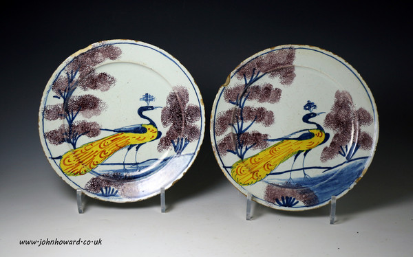 English delftware pottery plates a rare pair with peafowl in polychrome colours, Bristol  antique period mid 18th century