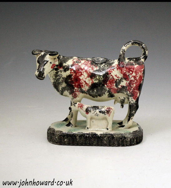 Antique English pottery figure cow creamer with calf early 19th century