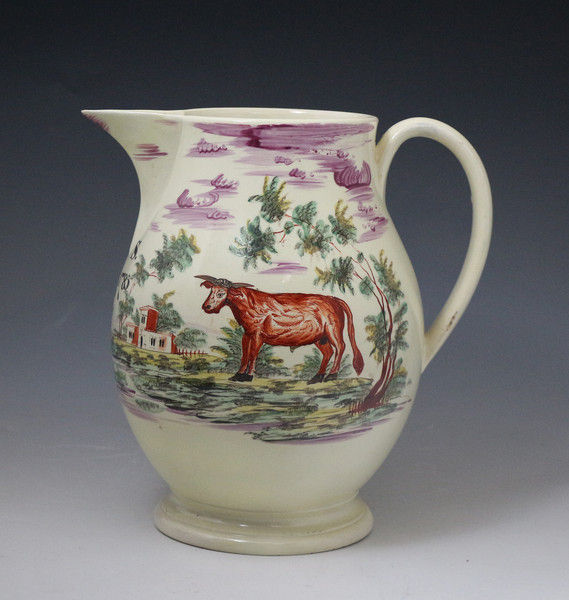 Creamware pottery decorated pitcher with rural images dated 1785 initialled AS.