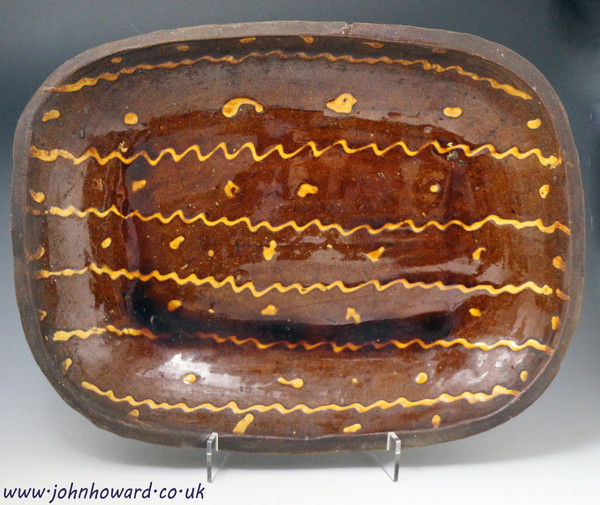 English slipware pottery baking  loaf dish late 18th century large size.
