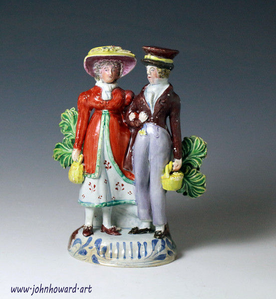 Antique pottery figure of the Dandies Staffordshire England early 19th century.