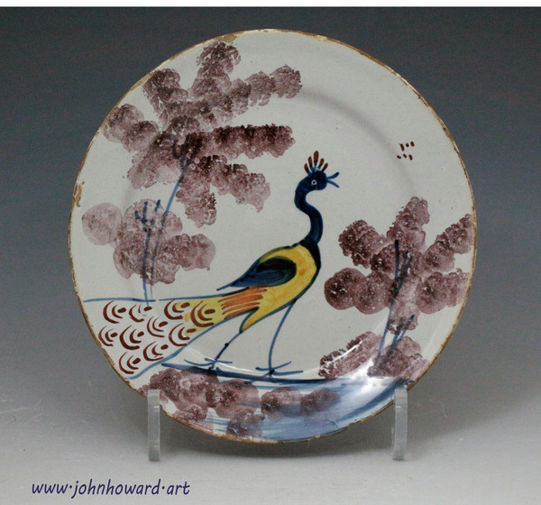 Antique English delftware pottery peacock plate of small size mid 18th century Bristol