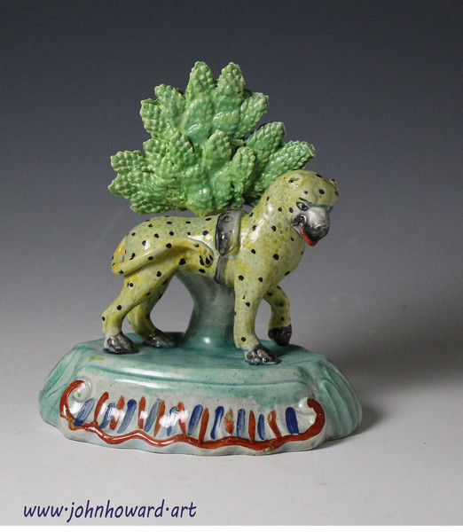Staffordshire pearlware pottery figure of a leopard with bocage antique period early 19th century