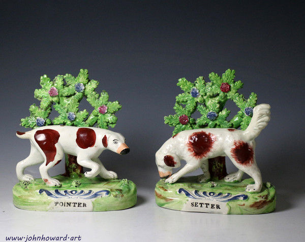 Pair of Staffordshire pottery dogs titled Pointer and Setter. made in 1820 period England