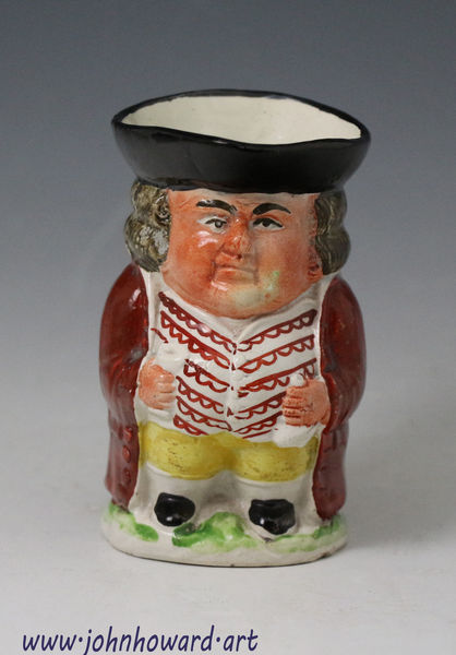 Staffordshire pottery pearlware Toby jug figure early 19th century England
