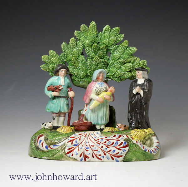 Staffordshire pottery figure of the Tithe Pig group with bocage circa 1820