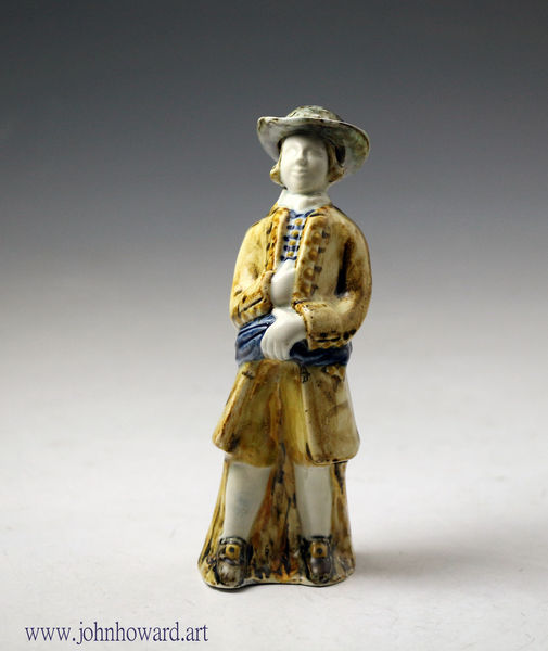 Creamware bodied standing figure of a gentleman possibly a merchant Whieldon type mid 18th century