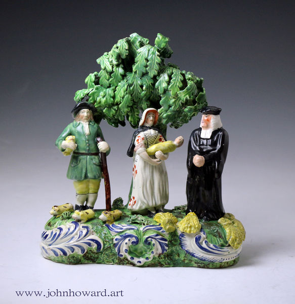 Staffordshire pottery tithe pig figure group with weeping bocage antique period early 19thc.