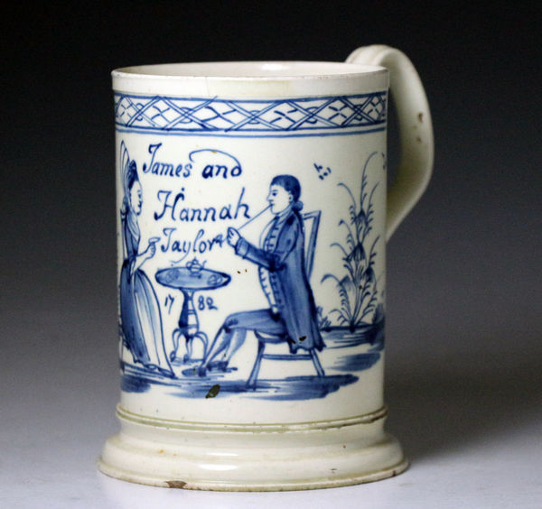 English creamware painted blue tea party tankard for James and Hannah Taylor dated 1782