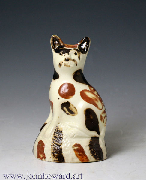 Creamware pottery figure of a cat from the Bovey Tracey Pottery Devon England circa 1800