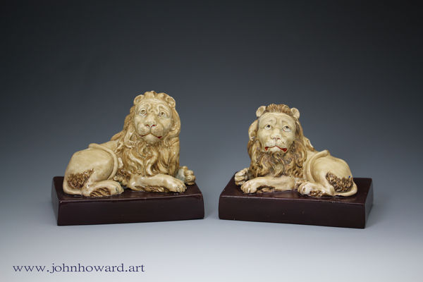Staffordshire pottery pair of lions by Wood and Caldwell early 19th century England