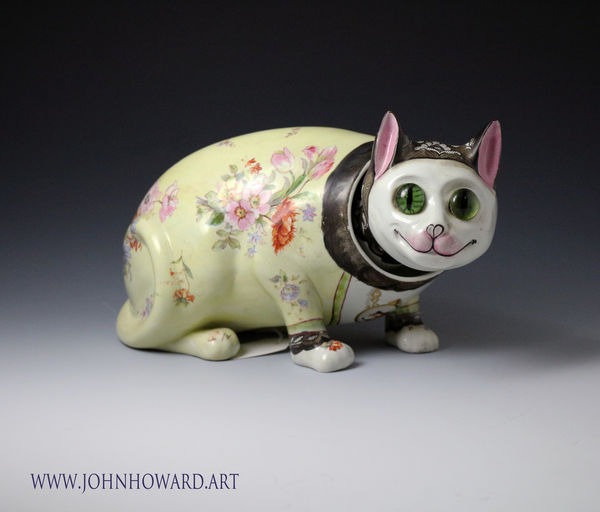 Galle style pottery nodding cat with glass eyes, a rare figure dating circa 1900