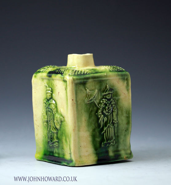 Tea Caddy mid 18th century creamware body with coloured green glaze, relief decorated with Chinese figures. Whieldon type.