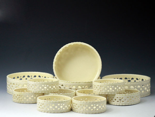 English creamware wine coasters  twelve  piece set. English pottery circa 1780 