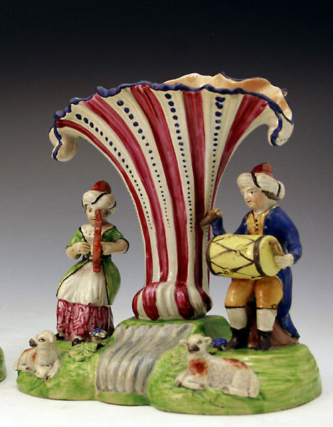 Staffordshire Pottery  trumpet spill vase with figures  of troubadors.