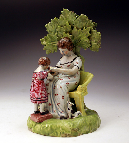 Antique Staffordshire Figure of mother and child at play. c1820