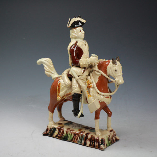 Staffordshire Creamware pottery Equestrian figure of a mounted officer of Astbury-Whieldon type.