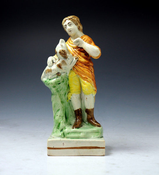English STaffordshire pottery figure of a boy and his dog c1790