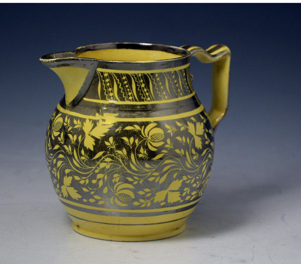 Canary yellow ground pitcher with silver resist decoration c1820