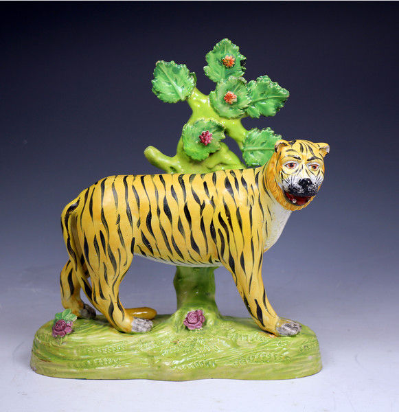 Antique Staffordshire pottery figure of a tiger with bocage from the Dale Pottery .