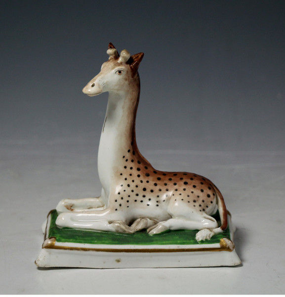 Antique Staffordshire porcelain figure of a seated Giraffe circa 1840 English