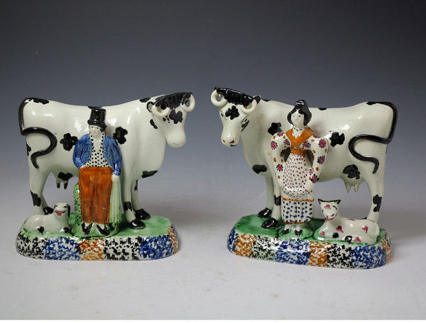 Pair of Yorkshire pottery figures of cows with attendants c1820