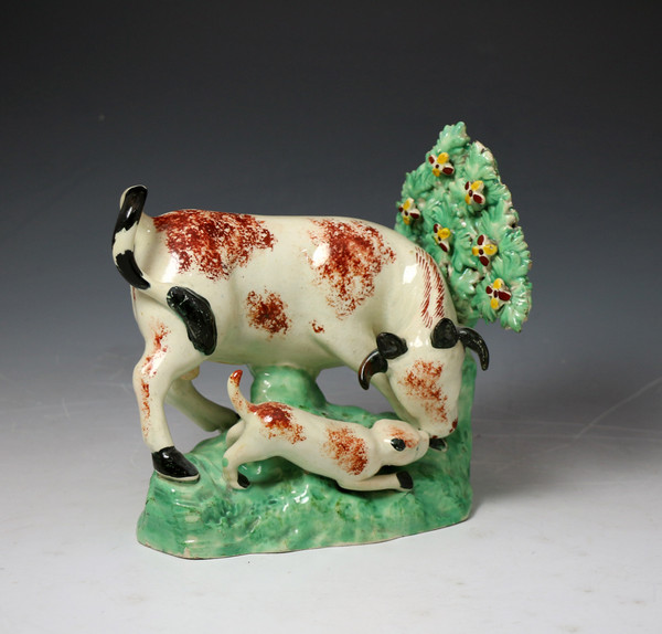 Staffordshire  pottery bull baiting figure group with rare bocage feature c1815