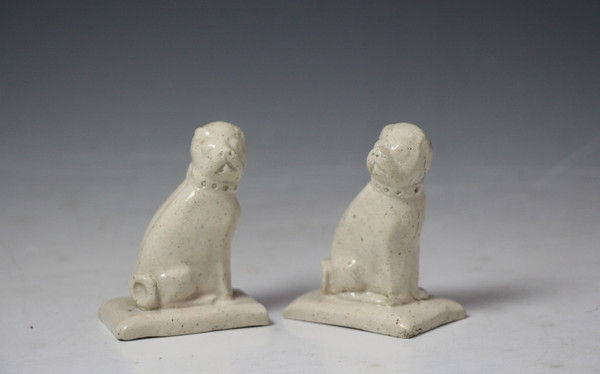 Rare pair of Staffordshire  saltglaze pottery figures of pug dogs c1760