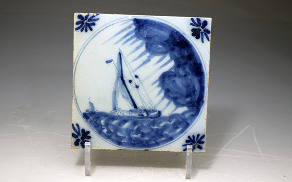 English Delftware blue and white tile with ship in a storm 18th century