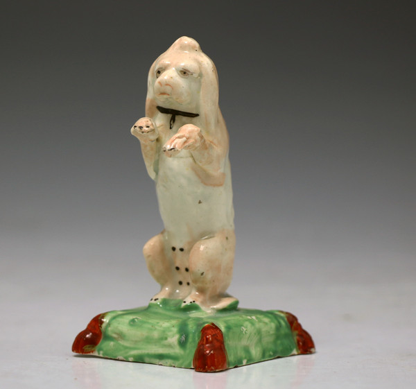 ANTIQUE STAFFORDSHIRE POTTERY FIGURE OF A BEGGING DOG EARLY 19TH CENTURY