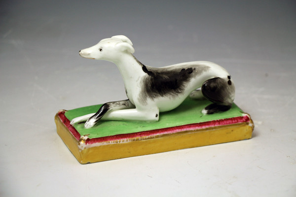 Staffordshire figure of a whippet on base, antique period circa 1840