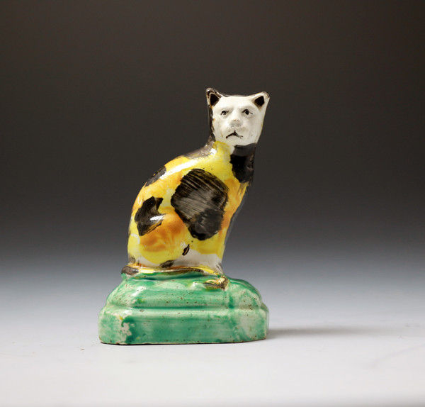 English Staffordshire  pottery figure of a seated cat early 19th century period.