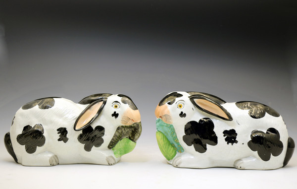 Antique English pottery black and white rabbits eating leaves Staffordshire circa 1855