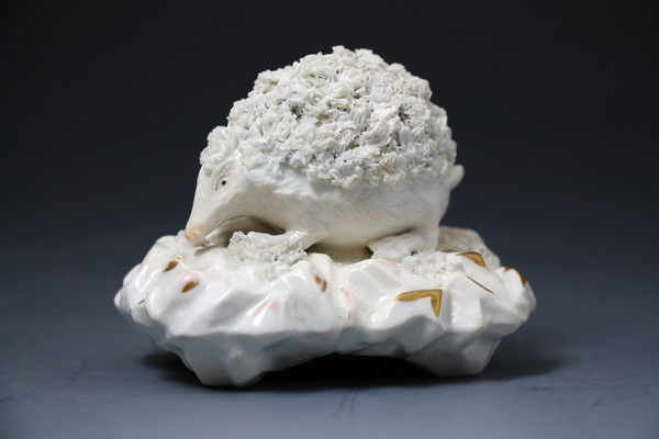 Antique Staffordshire  English porcelain figure of a hedgehog on gilded base early 19th century period.