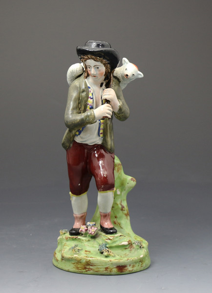 Antique Staffordshire pottery figure of 