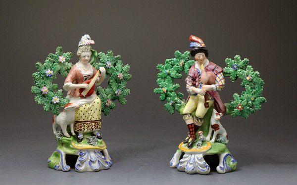 Pair of antique Staffordshire pearlware figures of musicians with bocage England early 19th century period