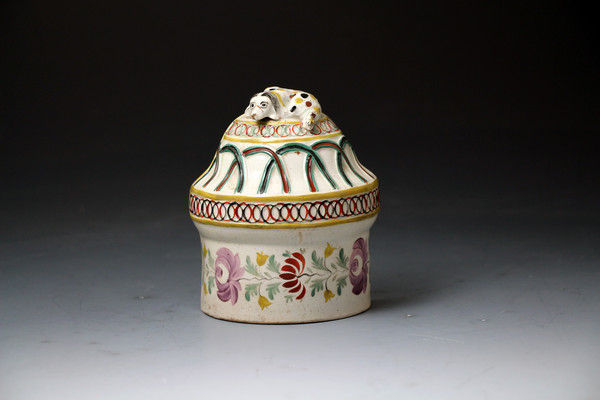 Antique English Staffordshire poittery of a bird feeder with figure of a dog early 19th century