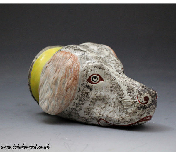 Staffordshire pottery figure of a hounds head in the form of a stirrup cup c1815
