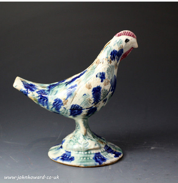 Antique Scottish pottery figure of a bird in the form of a money bank. 