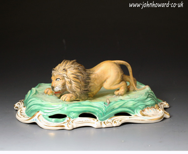Antique English porcelain figure of a crouching lion