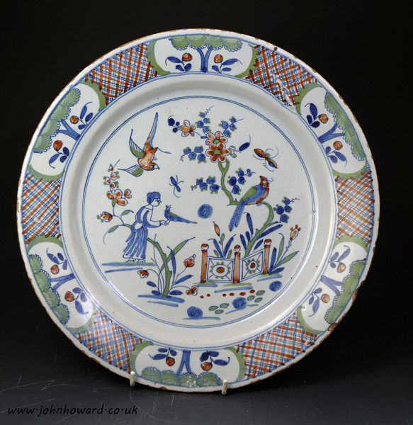 English delftware polychrome decorated charger probably London c1750