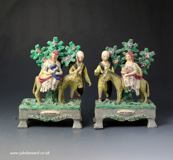 Antique pair of Staffordshire pottery pearlware table base figures of the Flight and Return early 19th century