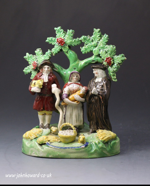 Staffordshire pottery pearlware figure group PIG TITHE early 19th century.