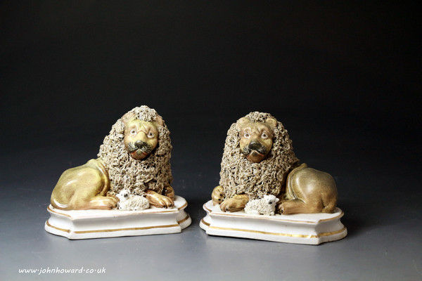 Pair of Staffordshire porcelaineous  figures of Lions with Lambs. English circa 1836