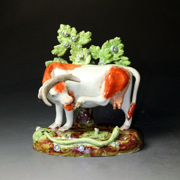 Antique Staffordshire pearlware pottery bocage figure of a cow circa 1820