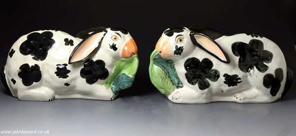 Antique Staffordshire pottery figures of rabbits munching leaves mid 19th century English